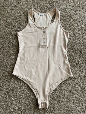 Reoria Beige Ribbed Henley Racerback Bodysuit with Snap Crotch